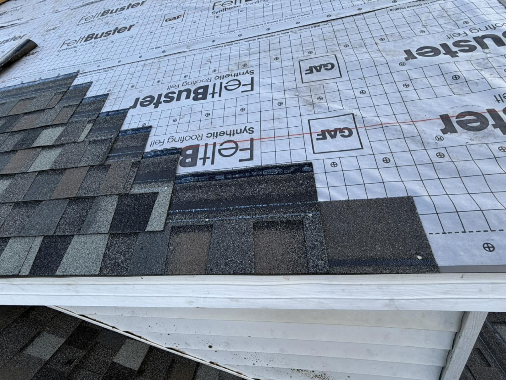 Close-up of roofing underlayment and shingles