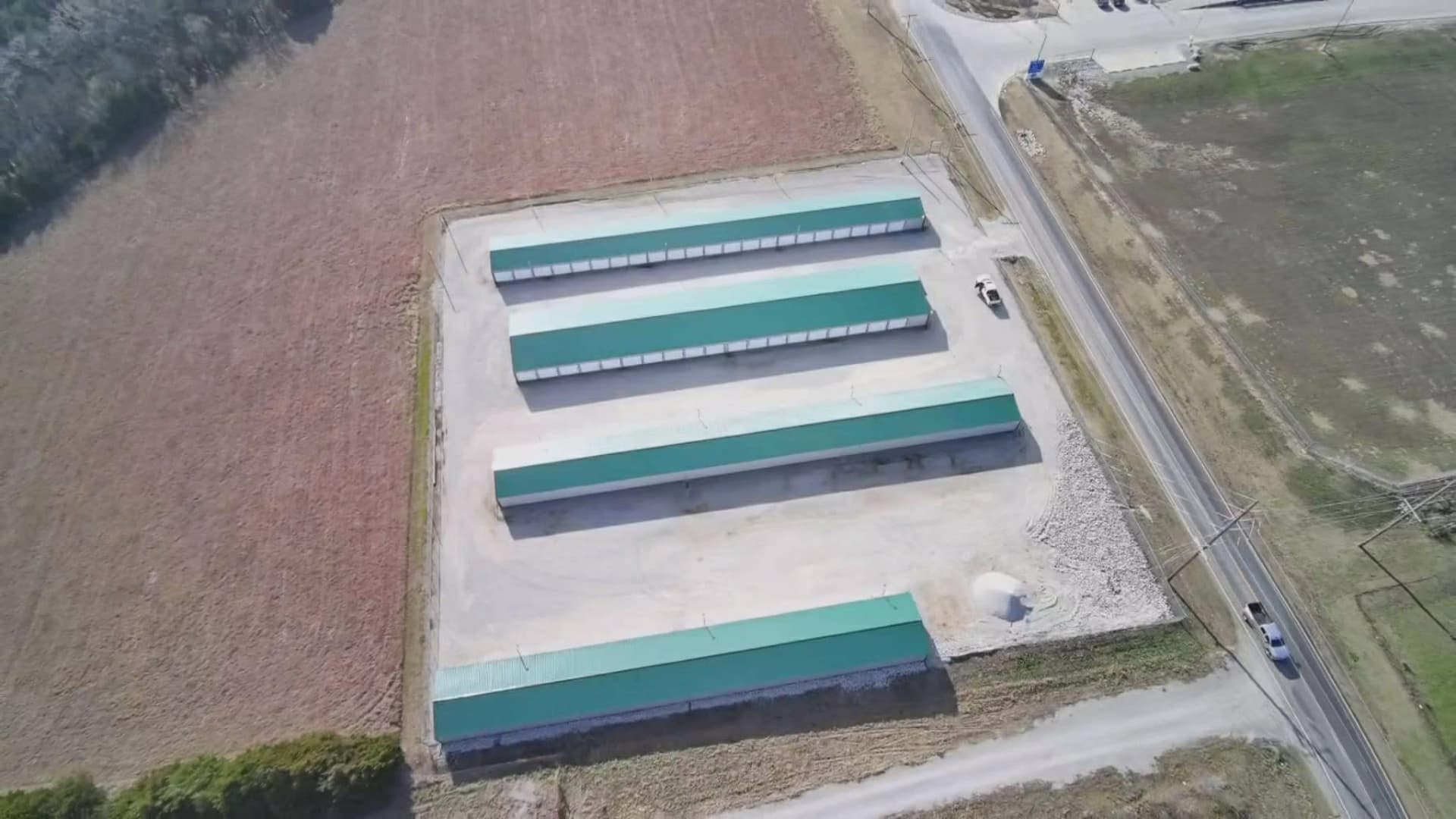 Aerial view of completed metal-roofed buildings