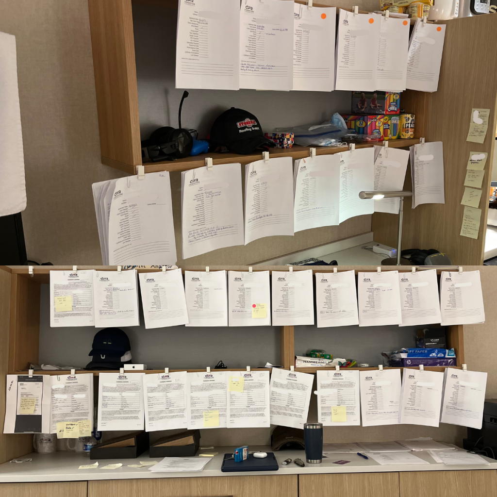 Files of completed roofing projects organized in the Veterans Elite Contractors office