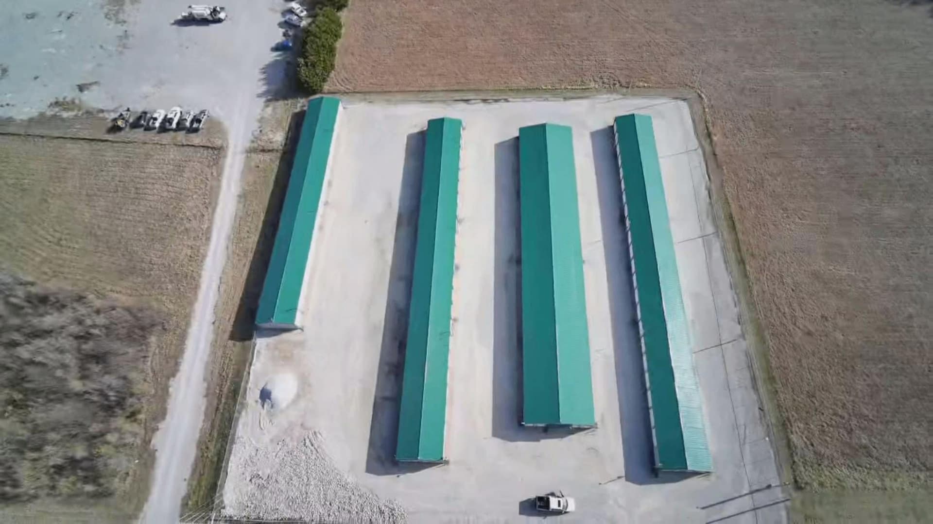 Top-down aerial view of completed metal-roofed buildings